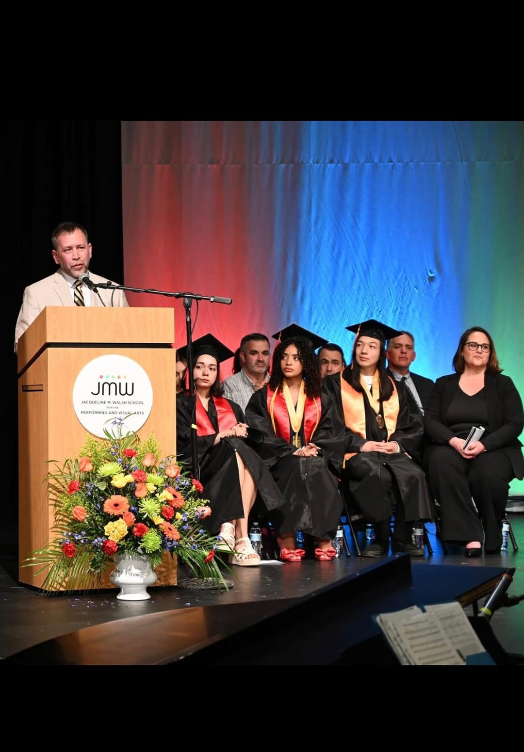 Juan Pablo Barrera speaking to a seated audience in an education setting.